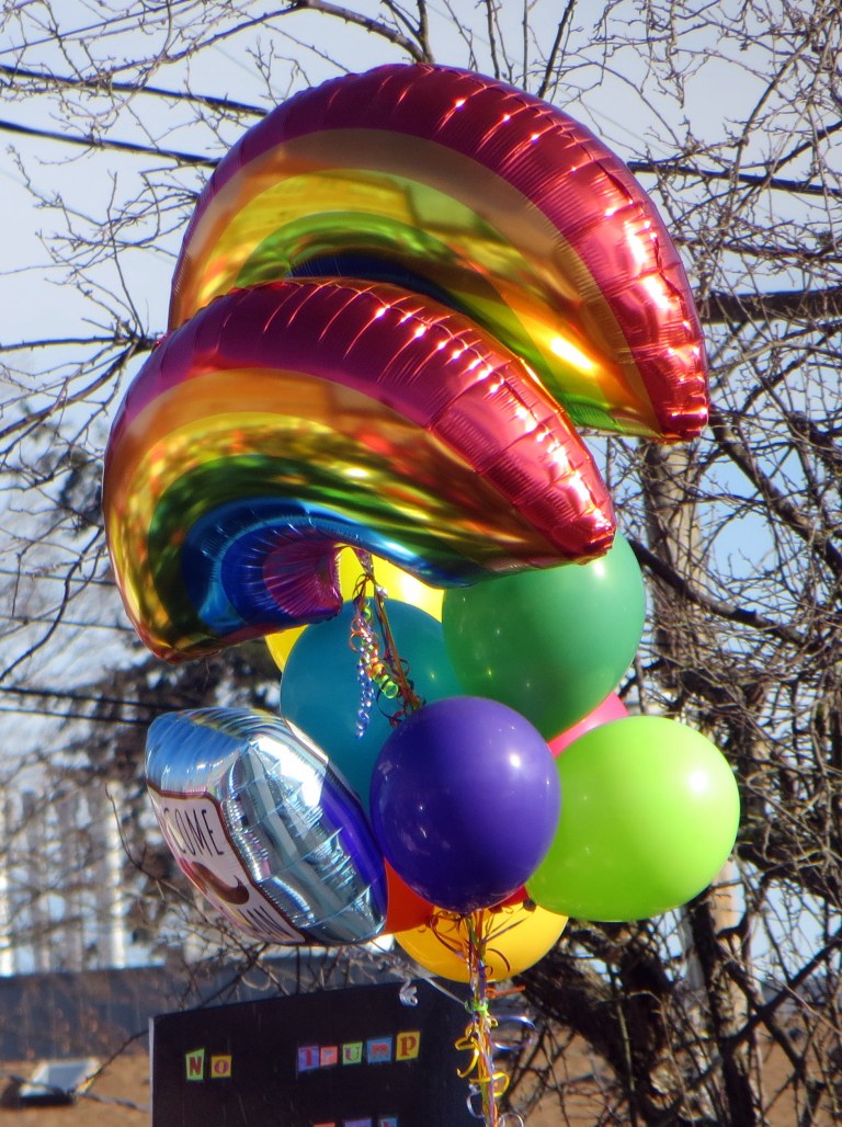 Scatter Joy. Womxn's March. Rainbow balloons.